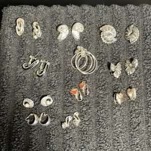 Clips Earrings (11 pair) color is silver.